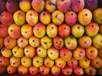 Full frame shot of stacked mangoes