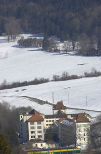 Houses on snow covered landscape