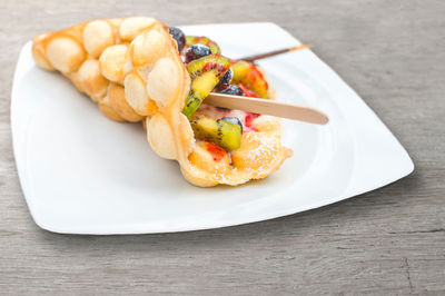 Trend pastry bubble waffles egg waffles, hong kong cakes with ice cream  fruits
