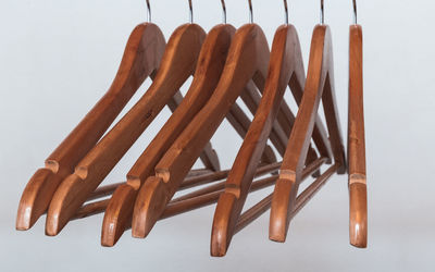 Close-up of clothes hanging on table against white background