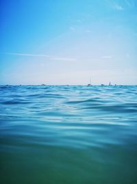 Scenic view of sea against blue sky