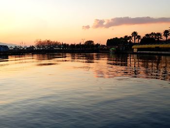 Scenic view of lake against sky during sunset