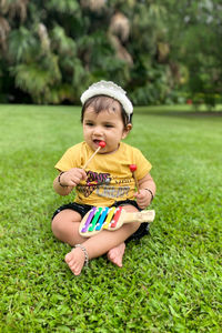 Portrait of cute girl playing with ball 1 year old