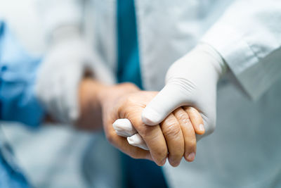 Close-up of hand holding hands