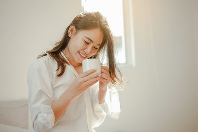 Young woman using mobile phone