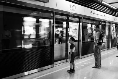 Blurred motion of train at railroad station