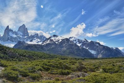 Scenic view of snow covered mountains against sky