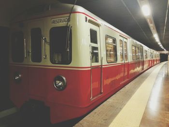 Train at railroad station at night