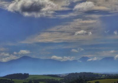 Landscape with mountain range in background
