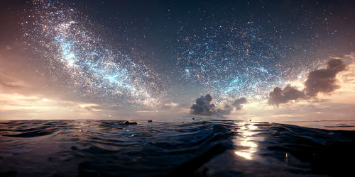 Low angle view of sea against sky at night