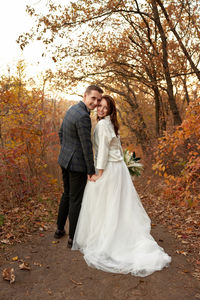 Portrait of bride standing in forest