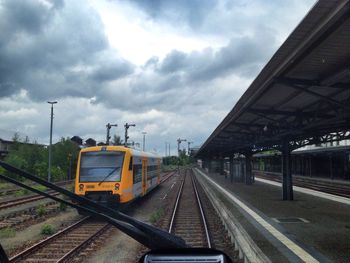 Railroad track seen through train windshield