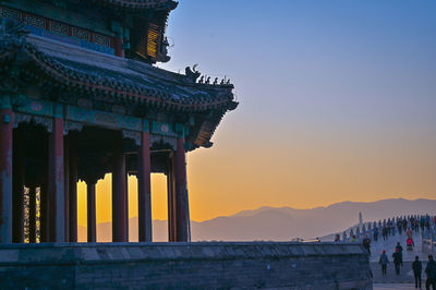 Traditional building against sky during sunset