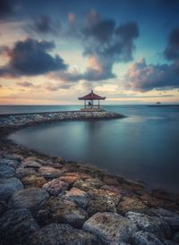 Scenic view of sea against sky at sunset