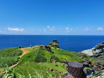 Scenic view of sea against blue sky