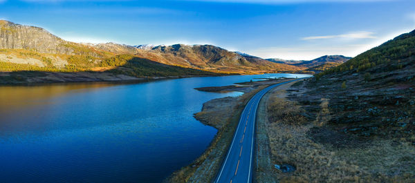 Scenic view of lake against blue sky