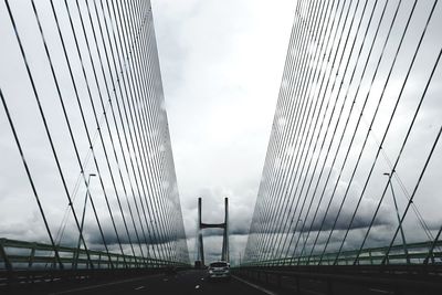 Bridge against sky in city