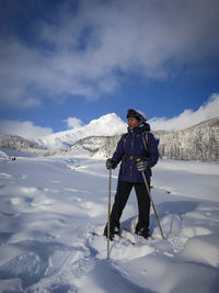 Full length of skier standing on field at mt hood in winter