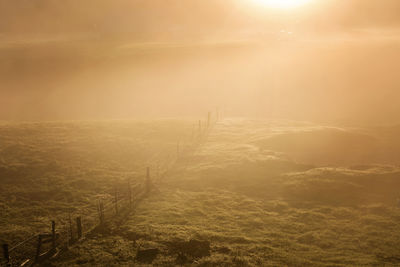 Scenic view of landscape at sunset