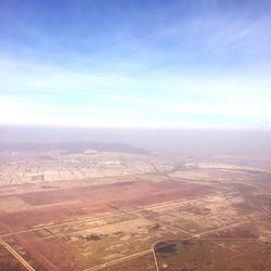 Aerial view of cityscape against sky