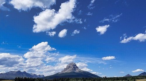 Panoramic view of landscape against blue sky