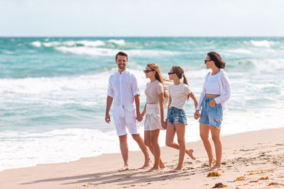 Family walking at beach