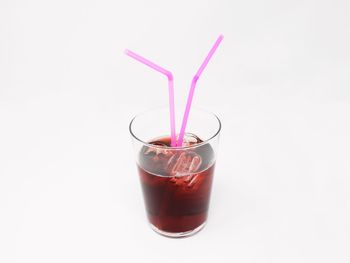 Close-up of drink against white background