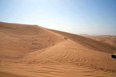 Scenic view of desert against clear sky