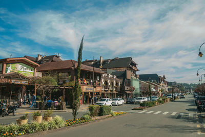 Buildings with shops and people on sidewalk at the main street of gramado, nrazil.