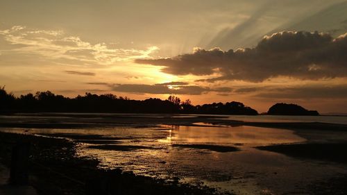 Scenic view of lake against sky during sunset