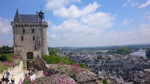 Chateau de chinon by town against sky