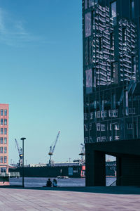 View of commercial dock against sky in city