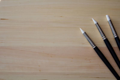 High angle view of equipment on wooden table