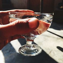 Close-up of hand holding wineglass