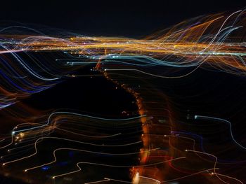 Light trails against sky at night