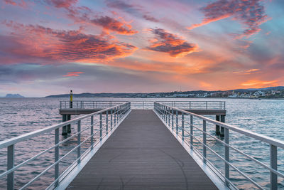 Pier on sea against sky