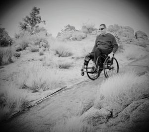 Woman cycling on road