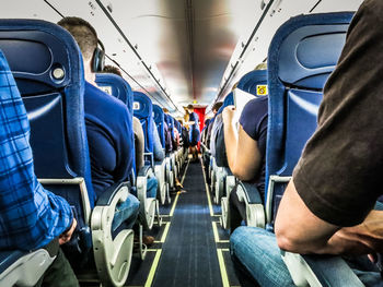 Rear view of man sitting in train