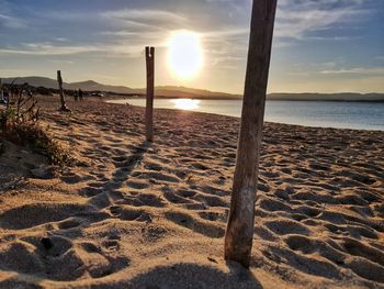 Scenic view of beach against sky during sunset