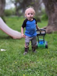 Portrait of boy playing in park