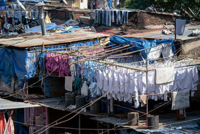 Clothes drying on rope against buildings