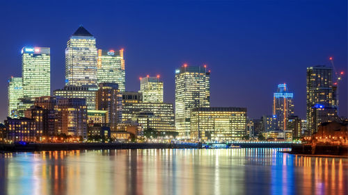 Illuminated buildings in city at night