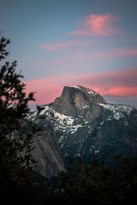 Scenic view of snowcapped mountains against sky during sunset