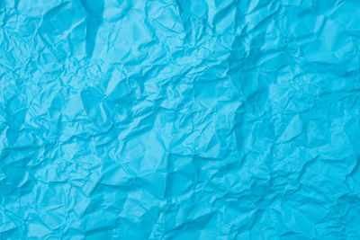 Full frame shot of blue crumpled paper