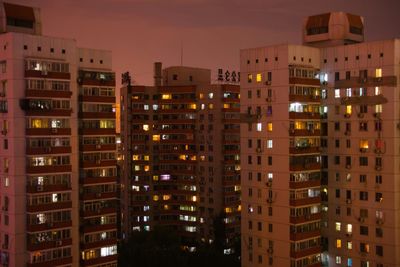 Low angle view of modern building at night