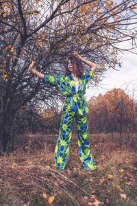 Full length of woman standing on field