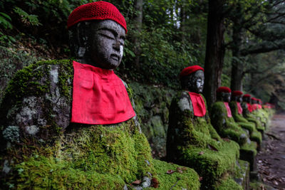 Statue of buddha against trees