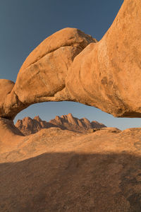 Rock formations in desert against sky