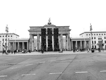 People in front of historical building