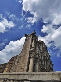 Low angle view of historical building against cloudy sky